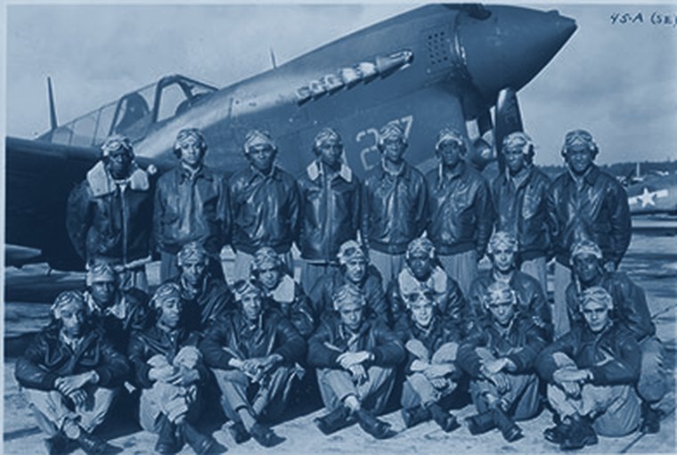 Tuskegee Airmen in 1943, in flight gear before their aircraft