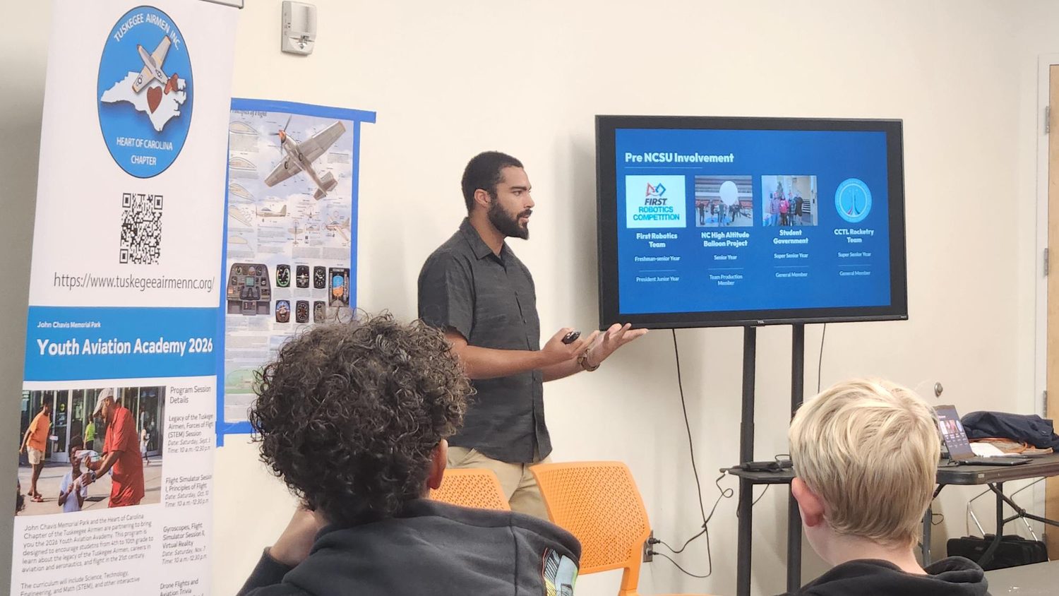 A guest speaker presents aerospace and engineering pathways to students